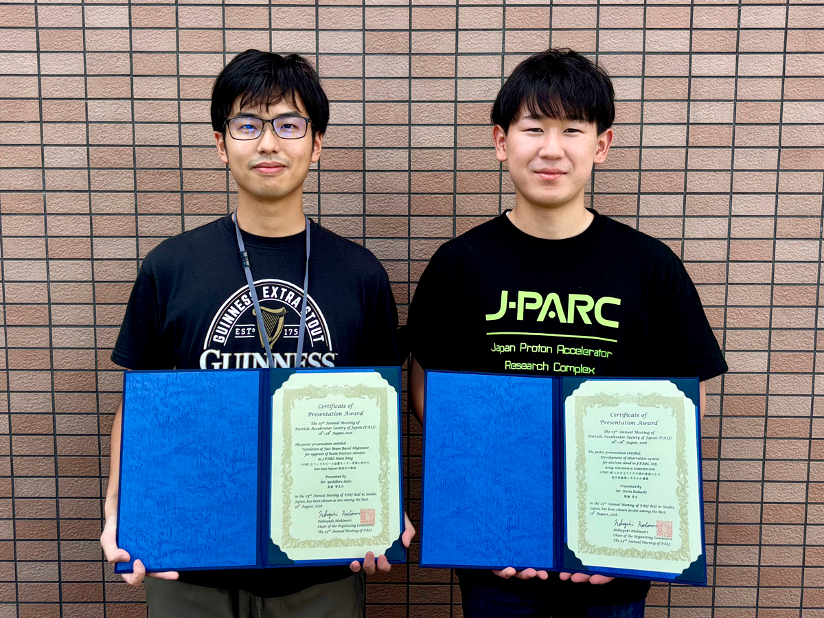 Yoshihiro Saito (left) and Keita Itahashi holding their award certificates