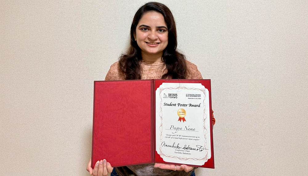 Pragya Nama holding her award certificate.